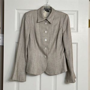 Attractive fitting etc. blazer with bell sleeves. Goes with everything!
